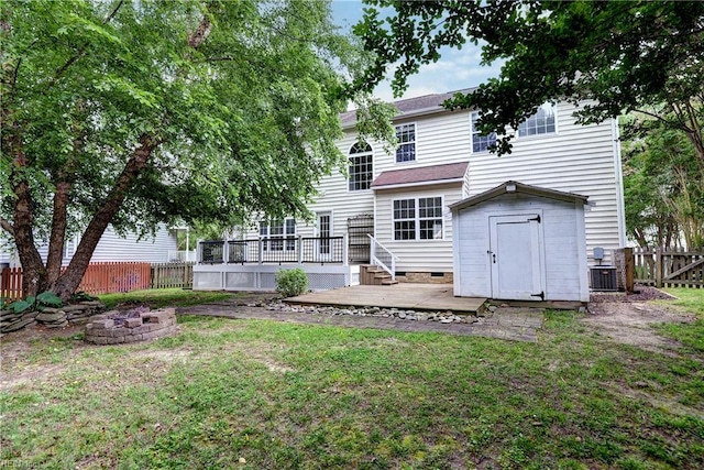 3248 Windsor Rdg, Williamsburg, VA 23188 - rear view of property with an outdoor fire pit, a fenced backyard, a deck, and a shed