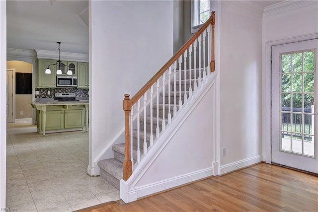 3248 Windsor Rdg, Williamsburg, VA 23188 - staircase with crown molding and arched walkways