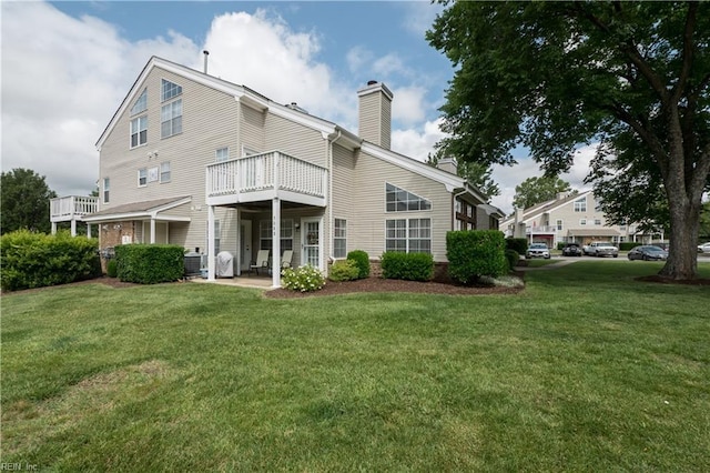 5088 Heathglen Cir, Virginia Beach, VA 23456 - rear view of house featuring a chimney and a lawn