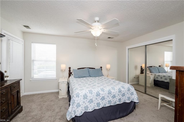 5088 Heathglen Cir, Virginia Beach, VA 23456 - bedroom featuring light colored carpet, a closet, a textured ceiling, and a ceiling fan