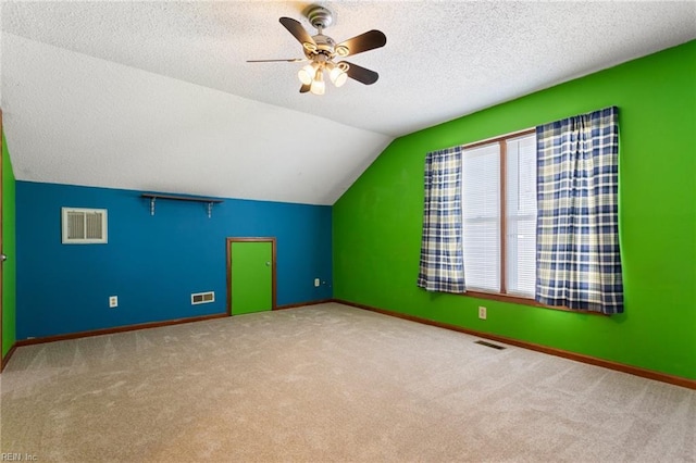 1121 Millay Ct, Virginia Beach, VA 23454 - additional living space featuring carpet floors, a ceiling fan, vaulted ceiling, and a textured ceiling
