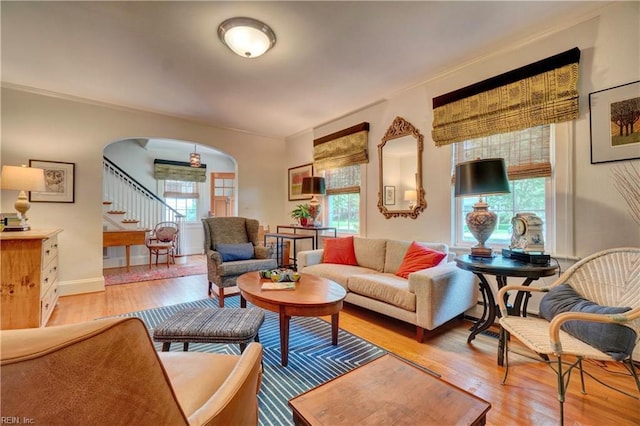 1357 Buckingham Ave, Norfolk, VA 23508 - living area featuring arched walkways, light wood-style floors, and stairway