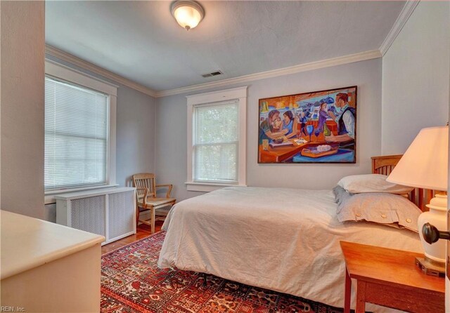 1357 Buckingham Ave, Norfolk, VA 23508 - bedroom with radiator, ornamental molding, and wood finished floors