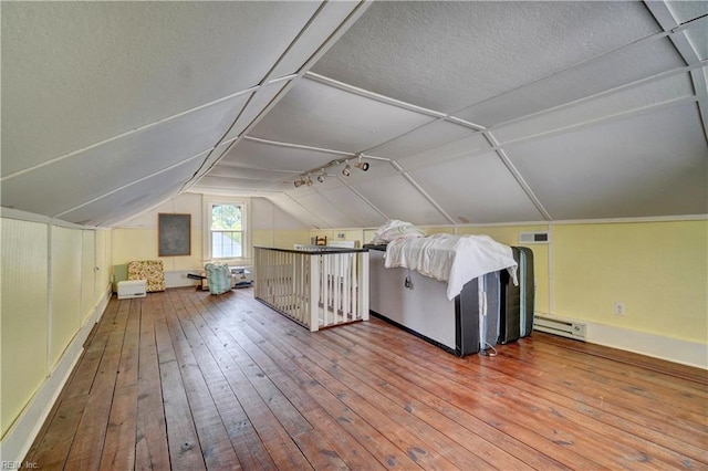 1357 Buckingham Ave, Norfolk, VA 23508 - bonus room with hardwood / wood-style floors, lofted ceiling, a baseboard heating unit, and a textured ceiling