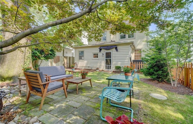 1357 Buckingham Ave, Norfolk, VA 23508 - back of house featuring outdoor lounge area, a fenced backyard, and a patio area