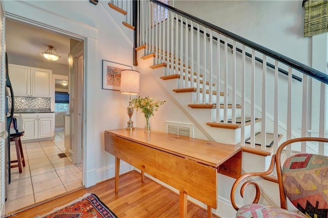 1357 Buckingham Ave, Norfolk, VA 23508 - staircase featuring baseboards and wood finished floors