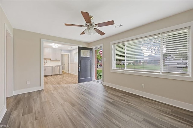 3332 Lusk St, Virginia Beach, VA 23464 - unfurnished living room featuring light wood-type flooring and ceiling fan