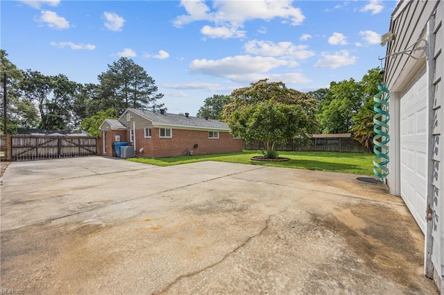 3332 Lusk St, Virginia Beach, VA 23464 - view of patio featuring driveway, a gate, and a garage