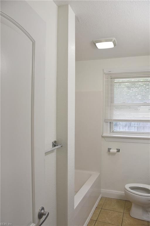 1910 N Lakeland Dr, Norfolk, VA 23518 - bathroom with tile patterned flooring and a bathtub
