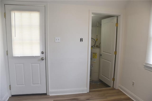 1910 N Lakeland Dr, Norfolk, VA 23518 - doorway featuring electric water heater and wood finished floors