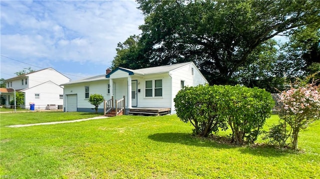 1220 E Balview Ave, Norfolk, VA 23503 - bungalow featuring a front yard, a chimney, and a garage