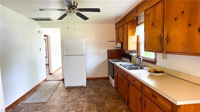 1220 E Balview Ave, Norfolk, VA 23503 - kitchen with white appliances, brown cabinets, and light countertops