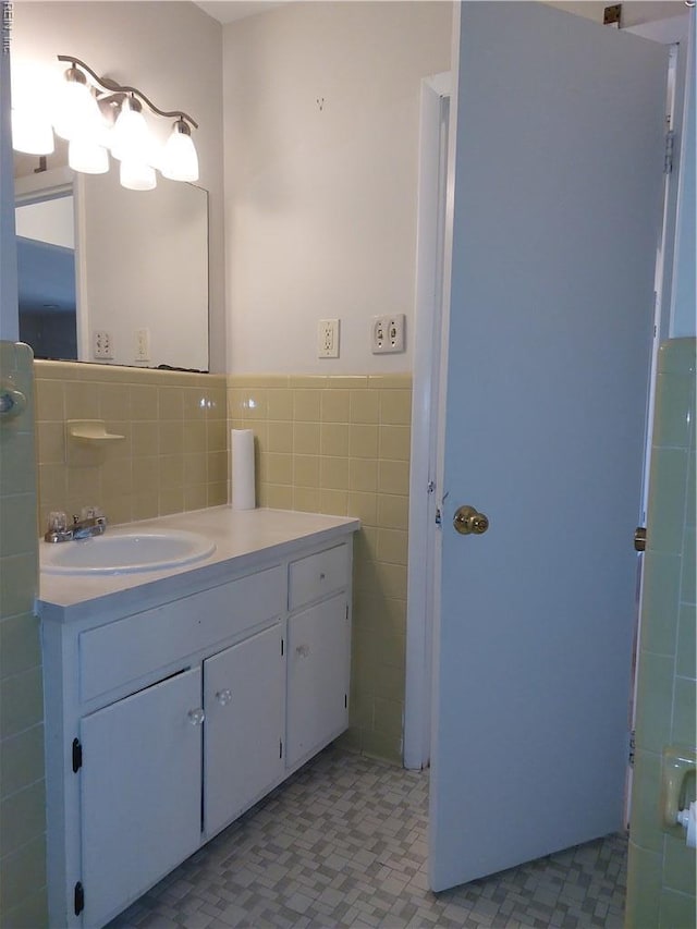 204 Devils Den Rd, Hampton, VA 23669 - bathroom featuring tile walls, vanity, wainscoting, and tile patterned floors
