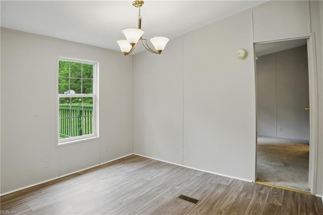 349 Pepper Cove Way, Susan, VA 23163 - unfurnished room with wood finished floors and a chandelier