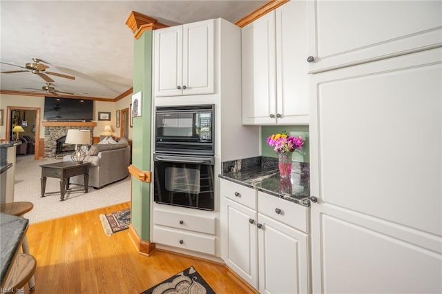 1040 Sanderson Rd, Chesapeake, VA 23322 - kitchen featuring black appliances, white cabinets, a ceiling fan, light wood finished floors, and ornamental molding