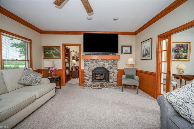 1040 Sanderson Rd, Chesapeake, VA 23322 - living room featuring carpet floors, wainscoting, ornamental molding, ceiling fan, and wooden walls