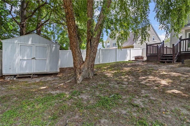 114 Lancelot Dr, Suffolk, VA 23434 - fenced backyard with a storage unit and a wooden deck