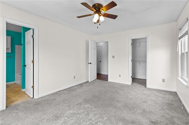 114 Lancelot Dr, Suffolk, VA 23434 - unfurnished bedroom featuring carpet, a walk in closet, a closet, ceiling fan, and connected bathroom