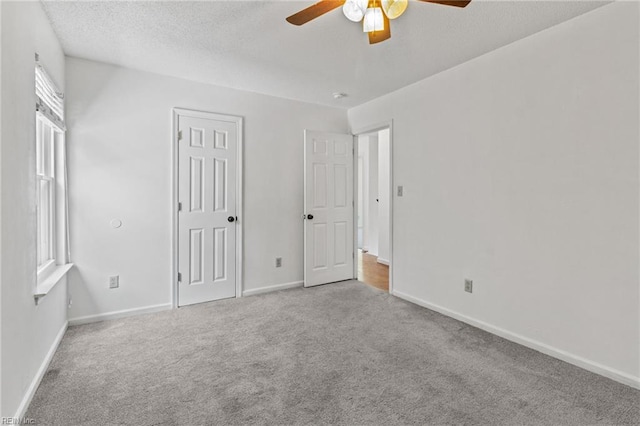 114 Lancelot Dr, Suffolk, VA 23434 - unfurnished bedroom featuring carpet, a textured ceiling, and a ceiling fan