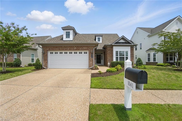 1041 Whitburn Ter, Chesapeake, VA 23322 - traditional-style house featuring an attached garage, brick siding, driveway, a front yard, and roof with shingles