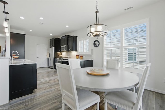1041 Whitburn Ter, Chesapeake, VA 23322 - dining room featuring light wood-style floors and recessed lighting