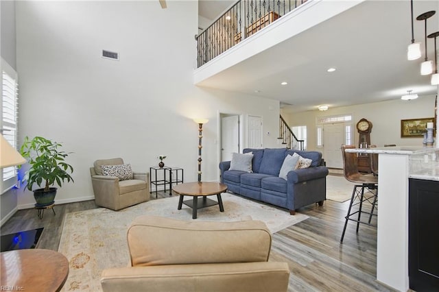 1041 Whitburn Ter, Chesapeake, VA 23322 - living area featuring stairs, wood finished floors, and a high ceiling