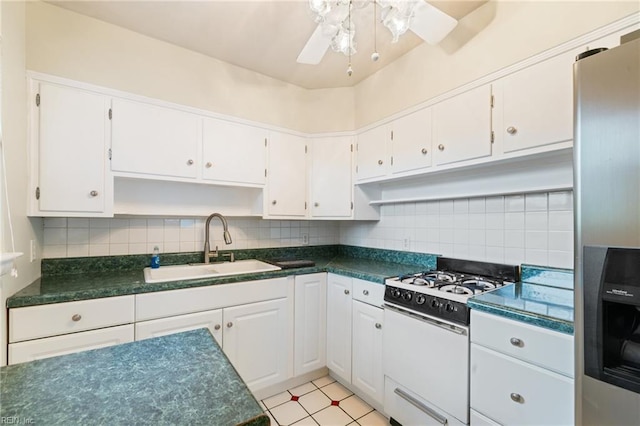 5813 Andrea Dr, Norfolk, VA 23518 - kitchen featuring white range with gas stovetop, open shelves, stainless steel fridge, and dark countertops
