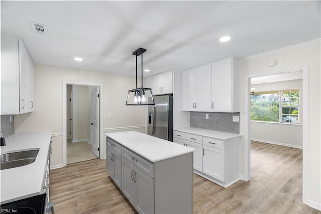 2001 Blackwell Ct, Virginia Beach, VA 23464 - kitchen with stainless steel fridge, light countertops, white cabinets, gray cabinetry, and recessed lighting