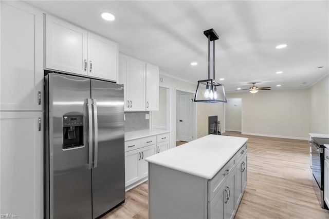 2001 Blackwell Ct, Virginia Beach, VA 23464 - kitchen with stainless steel fridge, a ceiling fan, white cabinets, a kitchen island, and recessed lighting