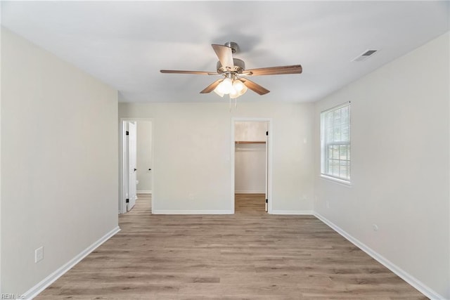 2001 Blackwell Ct, Virginia Beach, VA 23464 - unfurnished bedroom featuring light wood-style flooring, a spacious closet, ceiling fan, and a closet
