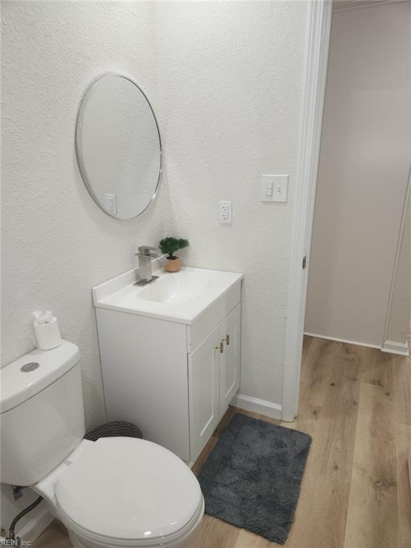 13031 Green Grove Ln, Newport News, VA 23608 - half bath with vanity and wood finished floors
