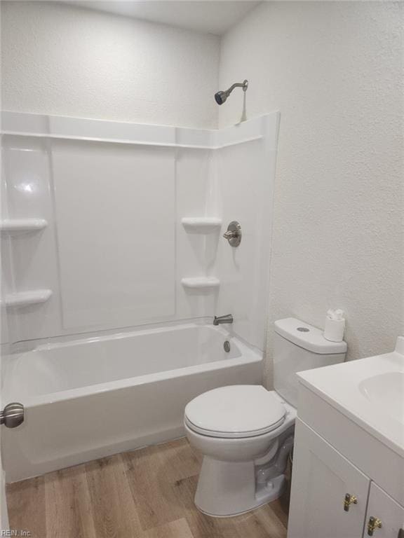 13031 Green Grove Ln, Newport News, VA 23608 - full bath with vanity, wood finished floors, bathtub / shower combination, and a textured wall