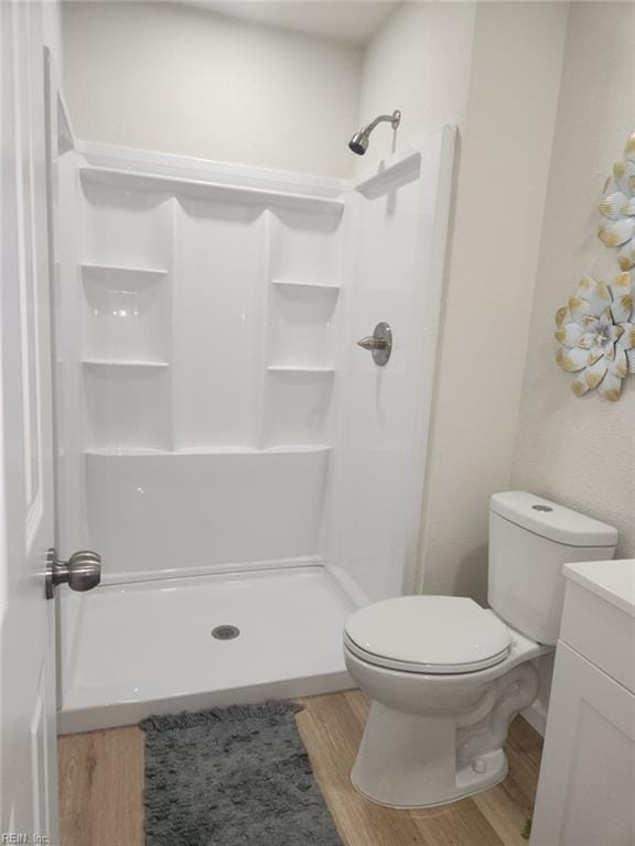 13031 Green Grove Ln, Newport News, VA 23608 - full bathroom with vanity, a shower, and wood finished floors