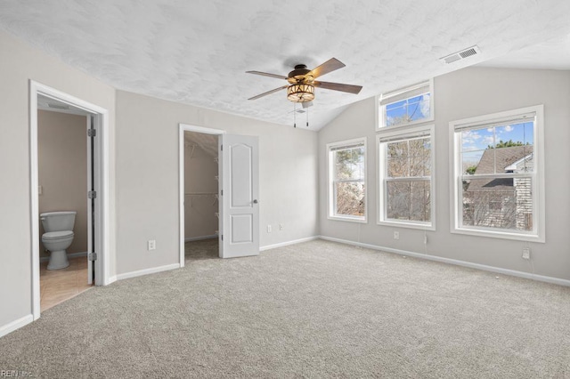 5561 Taylors Walke Ln, Virginia Beach, VA 23462 - unfurnished bedroom with carpet, lofted ceiling, a spacious closet, ensuite bathroom, and a closet