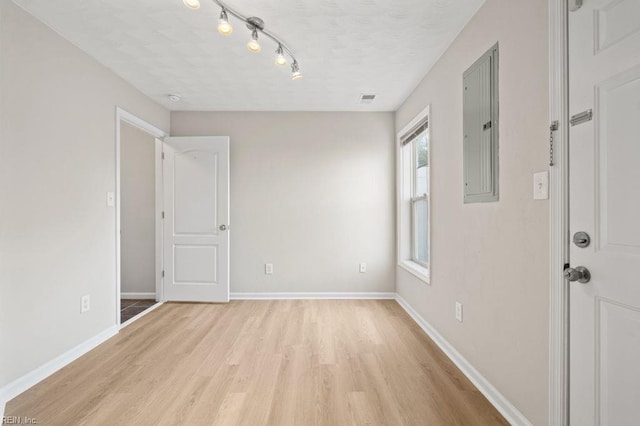 5561 Taylors Walke Ln, Virginia Beach, VA 23462 - spare room with light wood-style floors, electric panel, and rail lighting