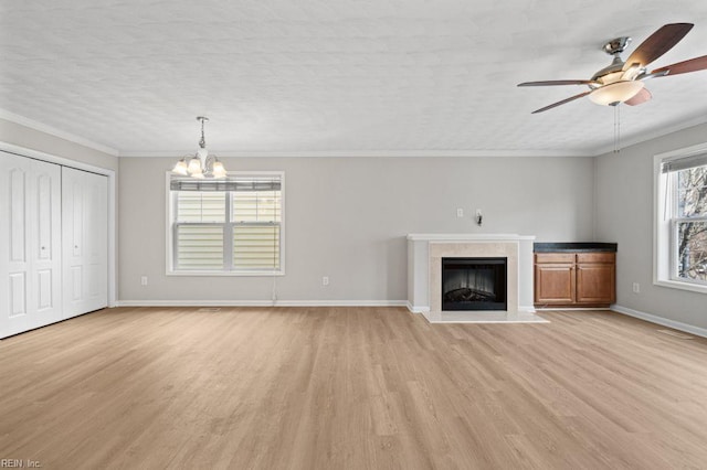 5561 Taylors Walke Ln, Virginia Beach, VA 23462 - unfurnished living room with light wood-style floors, a high end fireplace, a chandelier, a ceiling fan, and crown molding