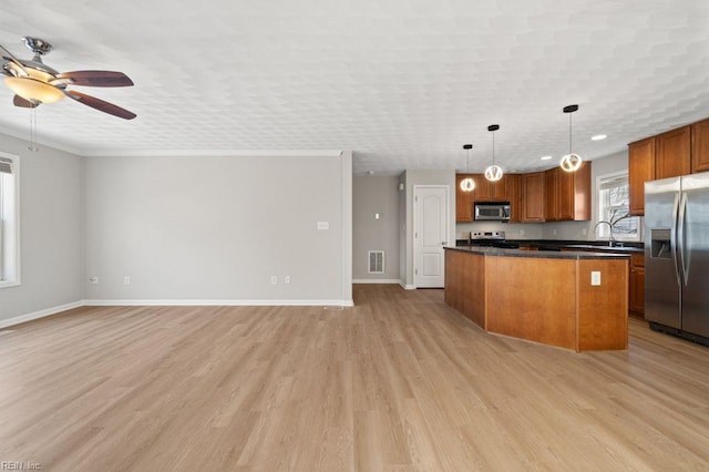 5561 Taylors Walke Ln, Virginia Beach, VA 23462 - kitchen featuring appliances with stainless steel finishes, a ceiling fan, a center island, dark countertops, and open floor plan