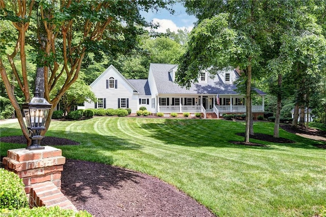 8265 Wrenfield Dr, Williamsburg, VA 23188 - cape cod home with covered porch and a front yard