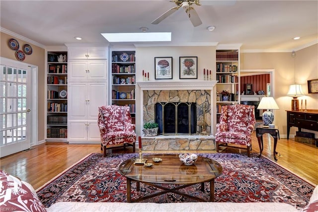 8265 Wrenfield Dr, Williamsburg, VA 23188 - living room with wood finished floors, ornamental molding, ceiling fan, a fireplace, and recessed lighting