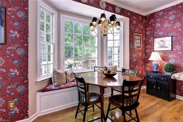 8265 Wrenfield Dr, Williamsburg, VA 23188 - dining space with light wood-type flooring, a chandelier, wallpapered walls, and ornamental molding