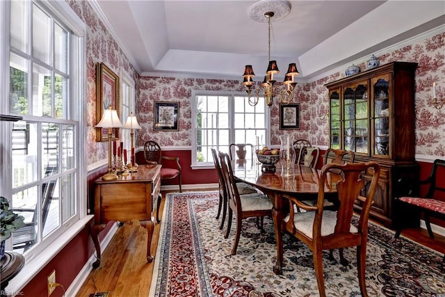 8265 Wrenfield Dr, Williamsburg, VA 23188 - dining area featuring wallpapered walls, a chandelier, wood finished floors, and wainscoting
