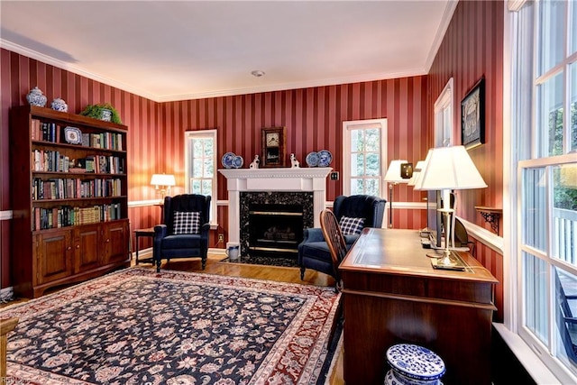 8265 Wrenfield Dr, Williamsburg, VA 23188 - office area with wallpapered walls, ornamental molding, healthy amount of natural light, a fireplace, and wood finished floors