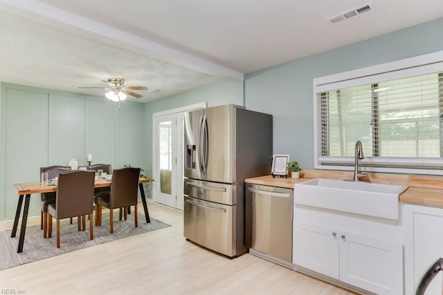 331 Silina Ct, Virginia Beach, VA 23452 - kitchen featuring appliances with stainless steel finishes, butcher block counters, white cabinetry, light wood finished floors, and ceiling fan