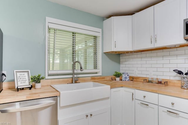 331 Silina Ct, Virginia Beach, VA 23452 - kitchen featuring wood counters, dishwasher, tasteful backsplash, and white cabinets