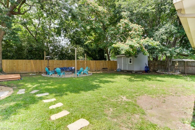 331 Silina Ct, Virginia Beach, VA 23452 - fenced backyard featuring an outdoor fire pit and a storage unit