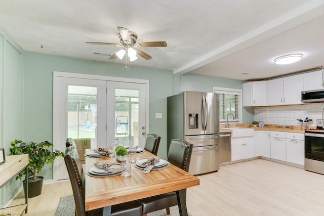 331 Silina Ct, Virginia Beach, VA 23452 - kitchen featuring appliances with stainless steel finishes, plenty of natural light, backsplash, and ceiling fan