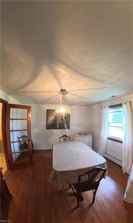 3244 Pruden Blvd, Suffolk, VA 23434 - dining room featuring wood finished floors and baseboard heating