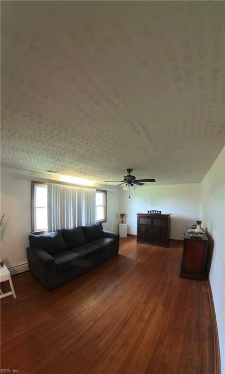 3244 Pruden Blvd, Suffolk, VA 23434 - living room featuring wood finished floors, ceiling fan, and a baseboard radiator