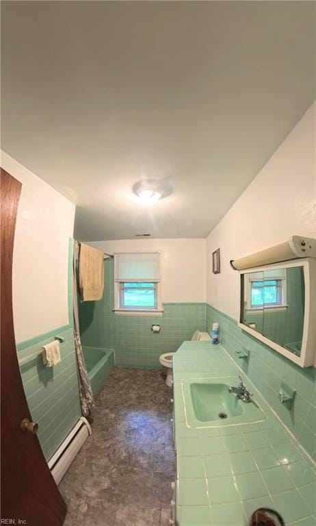 3244 Pruden Blvd, Suffolk, VA 23434 - full bath featuring tile walls, baseboard heating, wainscoting, vanity, and tile patterned flooring