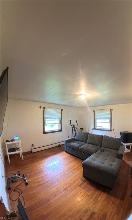 3244 Pruden Blvd, Suffolk, VA 23434 - living area featuring a baseboard radiator, healthy amount of natural light, and wood finished floors